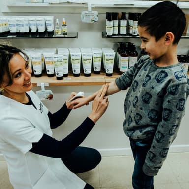 Karen from DermaGen applying Skin Radiance Lotion in store