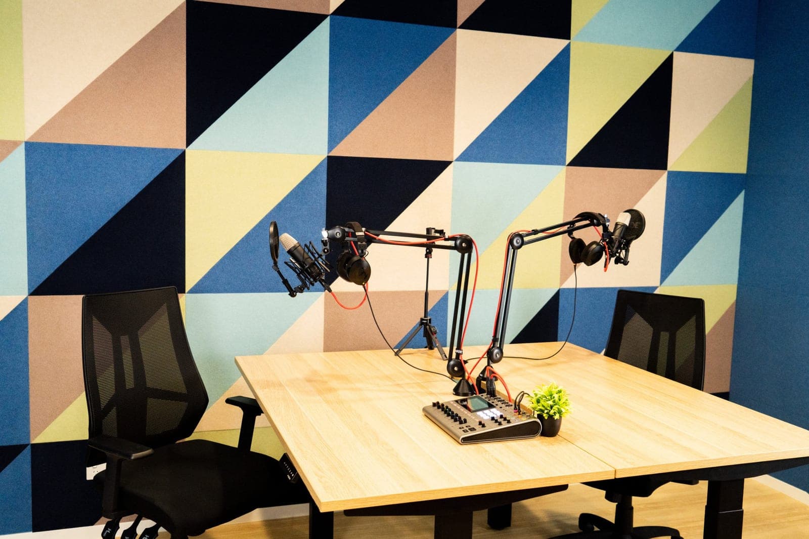 The TSH podcast studio at CH CoLab in Emerald, microphones over a timber table